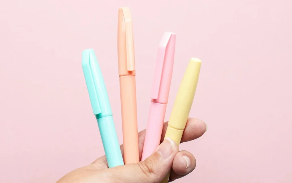 Pens on pink background